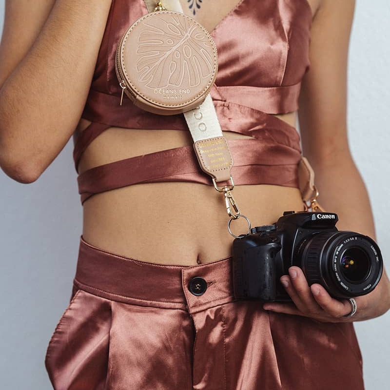 Luxury Strap with round zippered pouch in blush clipped on to Canon DSLR camera - Oceans End