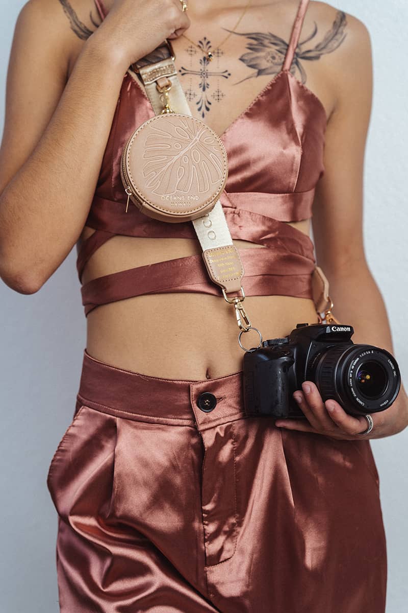 Luxury Strap with round zippered pouch in blush clipped on to Canon DSLR camera - Oceans End